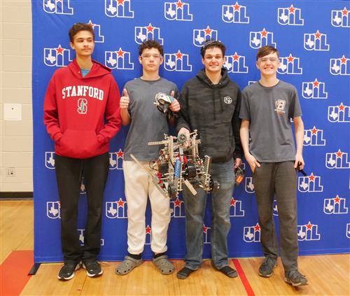 4 Bridgeland robotics students with their robot